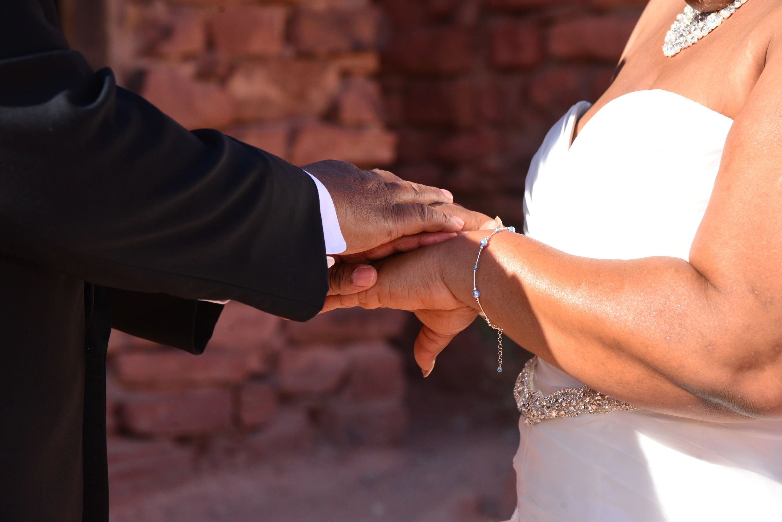 Bride and groom hands wedding ring ceremony